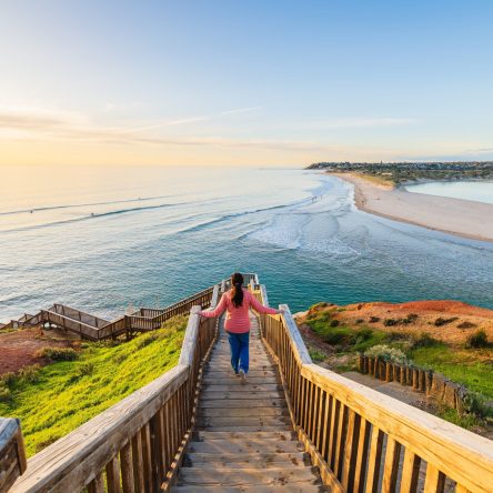 Woman,Gracefully,Descends,The,South,Port,Beach,Stairs,Captivated,By